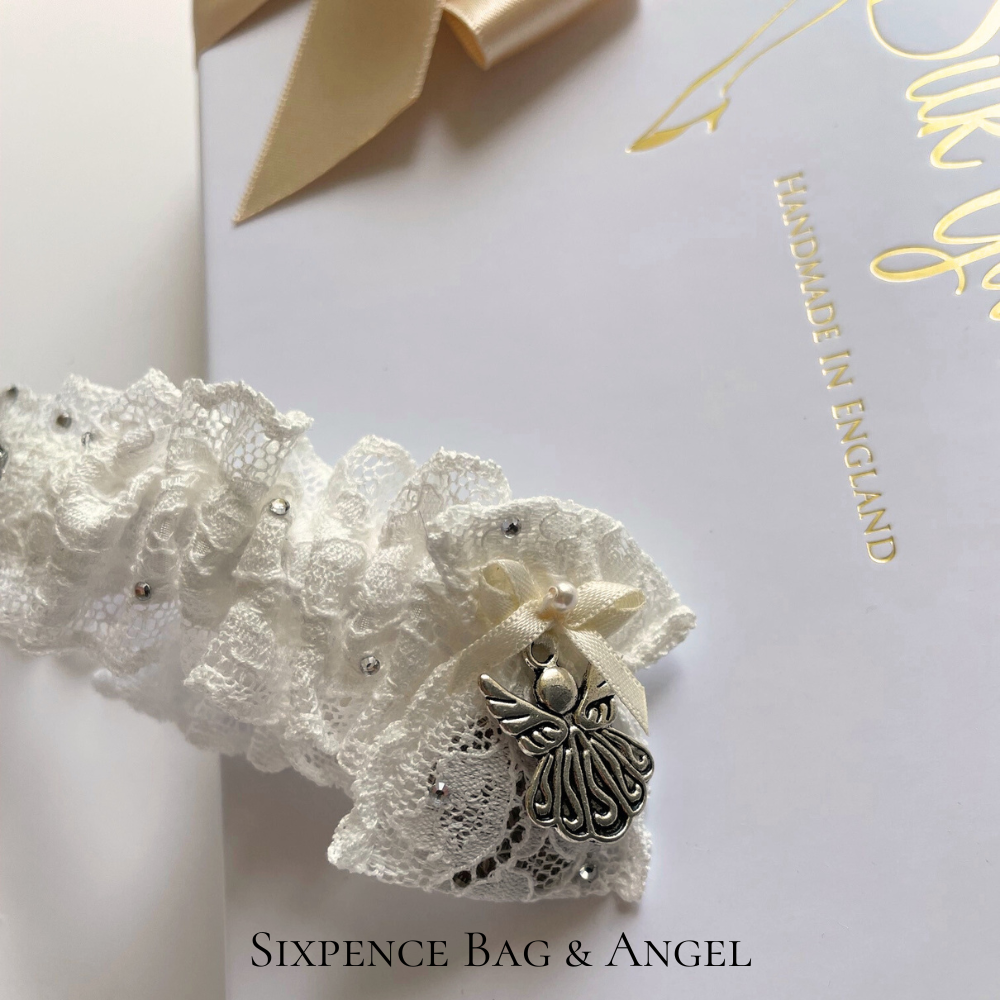 Silver sixpence and angel charm wedding garter